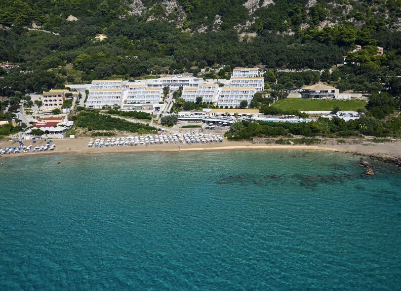 Aerial view of the shoreline infront of Pelekas Monastery resort, where you can engage in a seires of sea activities in Pelekas Corfu